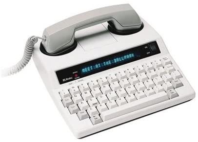 Picture of a TeleTYpewriter machine. The machine looks like a landline phone with a keyboard.
