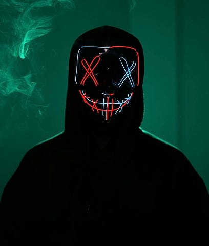 An image of a person with eyes and mouth made with fluorescent threads crossovers to depict the image of a stranger.