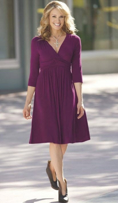 woman wearing purple v-neck empire waist dress