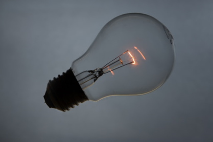 Image of a single lightbulb with faintly glowing filament, to illustrate post