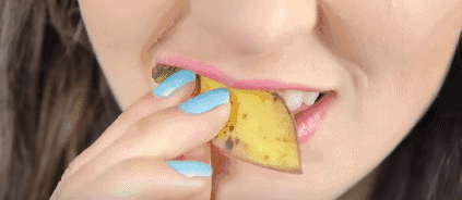 Rubbing teeth with banana peels