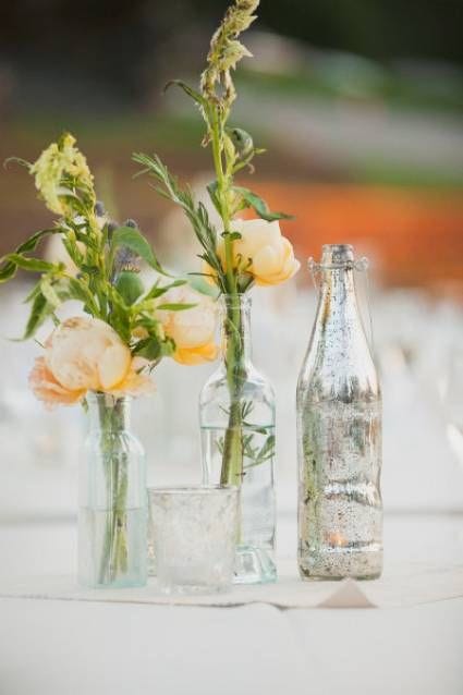 Reused glass bottle as a flower vases