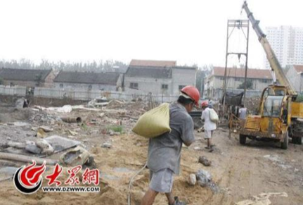 Image containing construction workers in hardhats.