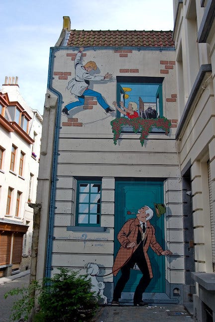 The side of a building covered in a cartoon depiction.