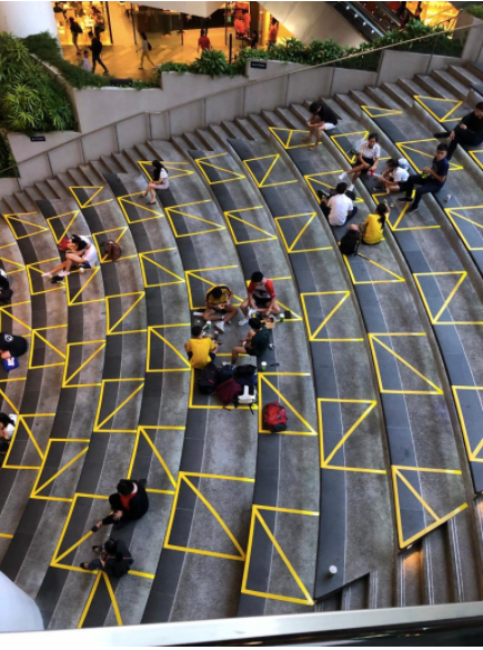 An outdoor arena is marked with yellow tape, indicating where people can sit.
