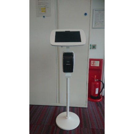 A white locking stand which holds a tablet at the centre which visitors can use to sign into the building