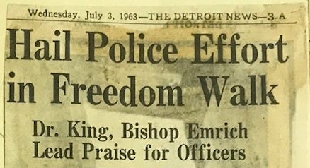 Newspaper clipping of The Detroit News on Wednesday, July 3rd, 1963. Title says “Hail Police Effort in Freedom Walk”. Subtitle says “Dr. King, Bishop Emrich Lead Praise for Officers”.