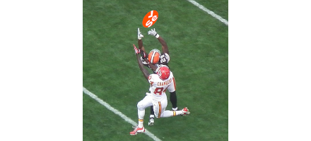 Opposing American Football players each trying to catch a thrown ball that is actually the Selenium Logo in a football shape.