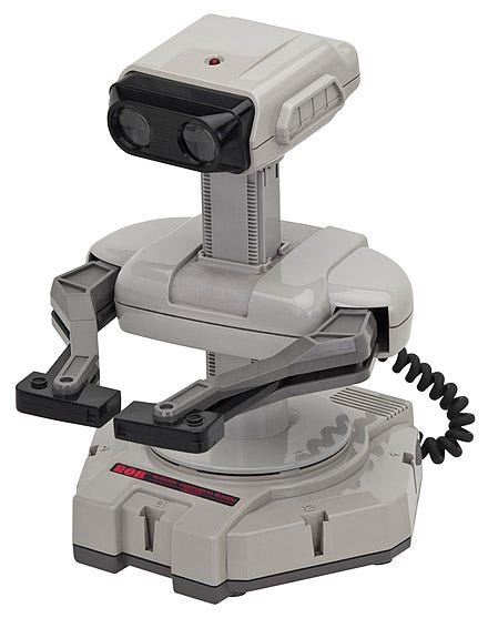 Figure 2: The Nintendo Robotic Operating Buddy or R.O.B., an accessory to the 8-bit Nintendo Entertainment System released in the US in 1985; it promised exciting interactions grounded in the NES worlds. Source: Wikipedia