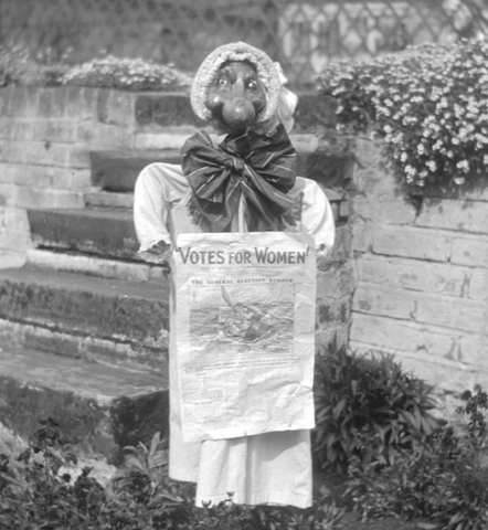 Scarecrow representation of a suffrage campaigner. Not the bulbous nose and dowdy hat.