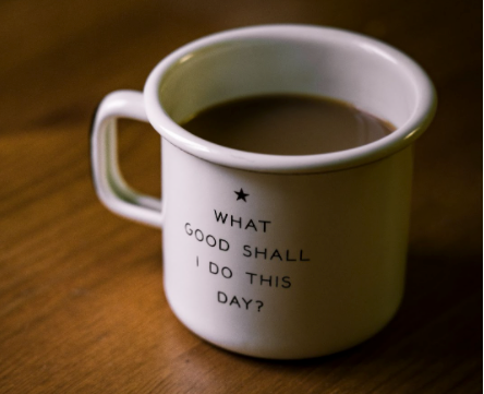 Cup of coffee with ‘What good shall I do this day?’ written on it