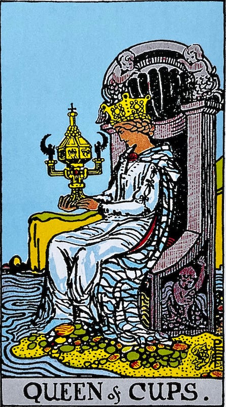 Queen of Cups — The Queen of Cups sits on her throne adorned with Cherubs. Her throne sits near a river or perhaps near the ocean. Her robe mingles with the water at her feet. She holds an ornate cup, the most ornate cup in the Rider-Waite-Smith deck. She is a good queen, strong and confident, a mature woman; She’s very much in touch with her emotions and intuitions.