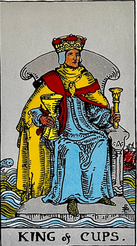 King of Cups — A king sits on a throne either on or surrounded by water.