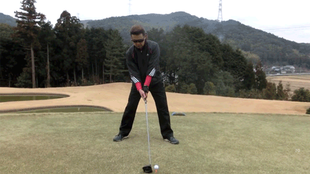 A golfer swinging a golf club like a ninja