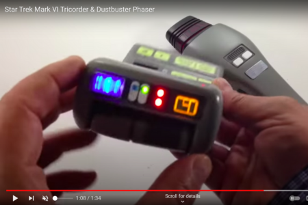 Toy Star Trek tricorder with two red lights on the front.