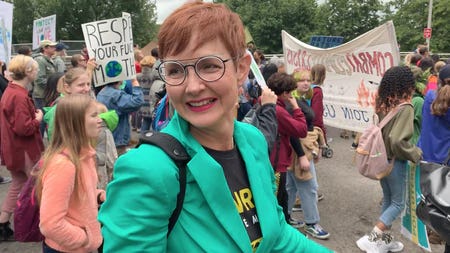 Sarah Iannarone smiling at a protest