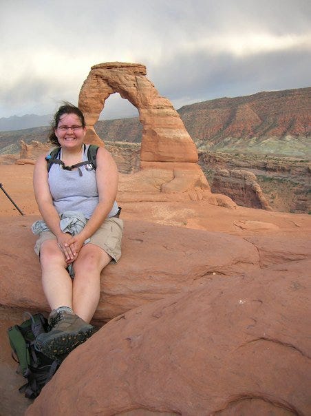 Me in front of Delicate Arch in Arches National Park on my road trip. It was raining the whole walk up slick rock, and as we approached the top the skies opened up and I was able to snap this picture.