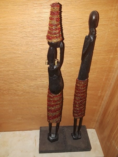 Two carved wooden statues.