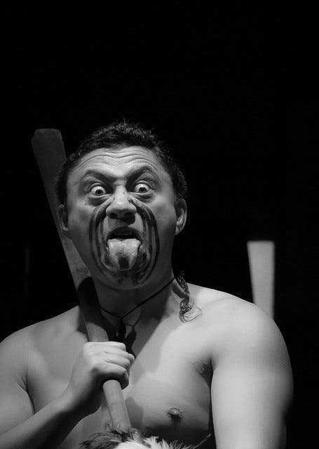 A Maori warrior with a Maori traditional face tattoo