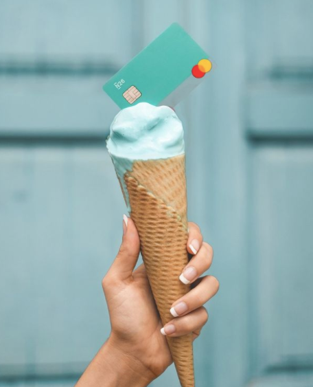 ice cream cone with debit card sticking out of it
