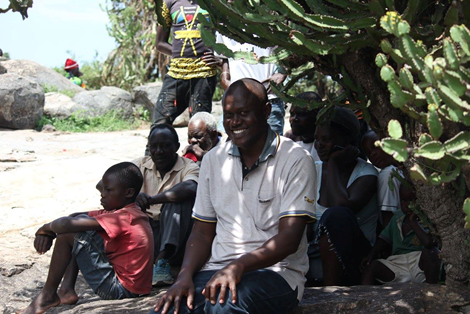 Reduce your impact using a simplication of your life. Joseph sharing shade in Tanzania.