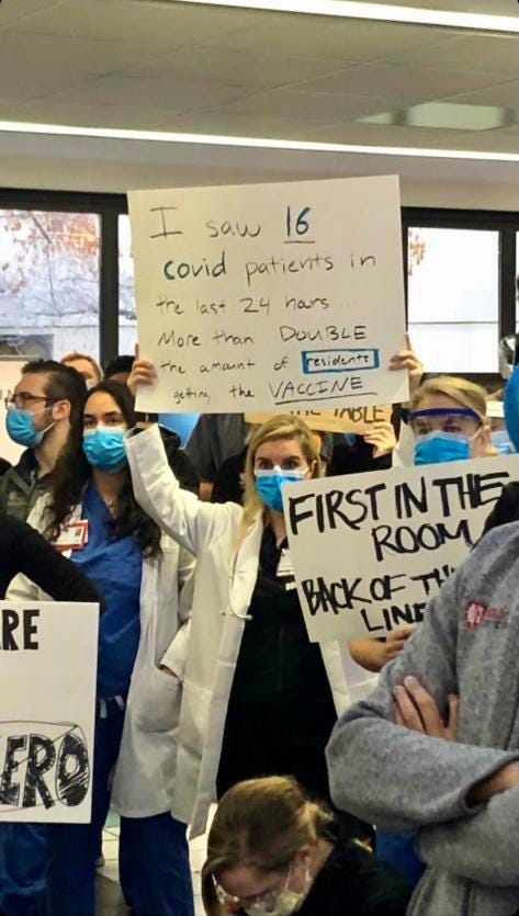 Protesting docter holds sign