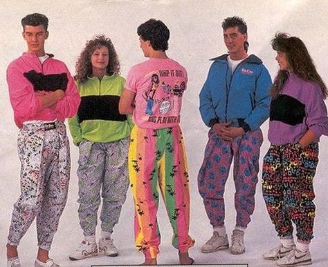 group of men and women in the 80s