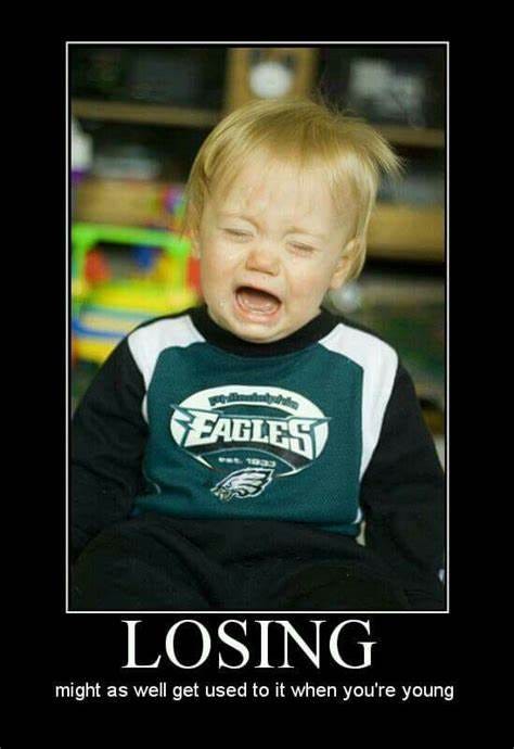 A toddler wearing a Philadelphia Eagles jersey and crying. Caption: “Losing. Might as well get used to it when you’re young.”