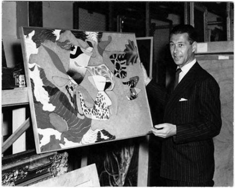 photo of Herbert Bayer posing with one of his paintings