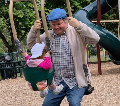 David with Ruth in a playground. Image ours.