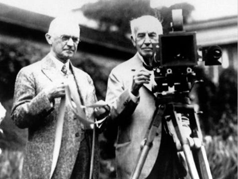 From right, George Eastman and Thomas Edison demonstrating the motion picture camera.
