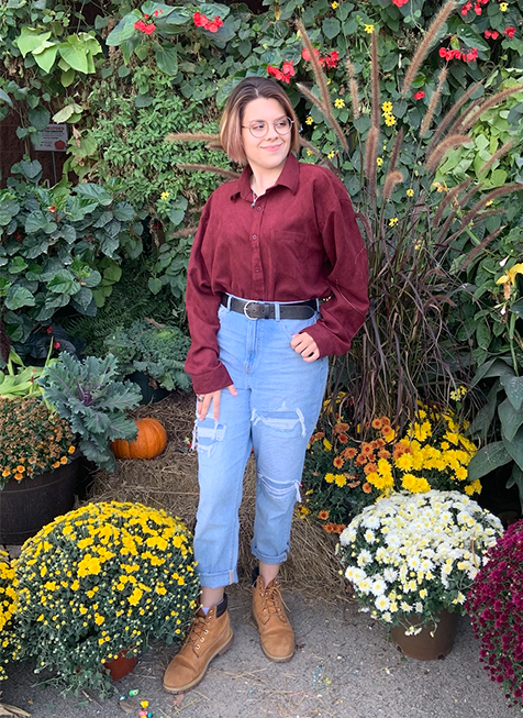 Alavi poses with various fall plants