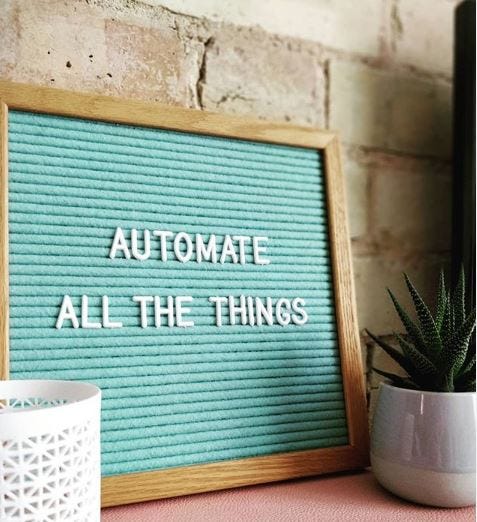 “Automate All the Things” written on a board
