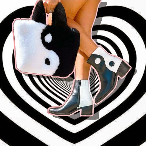 Person wearing MCLC black and white boots with black and white handbag