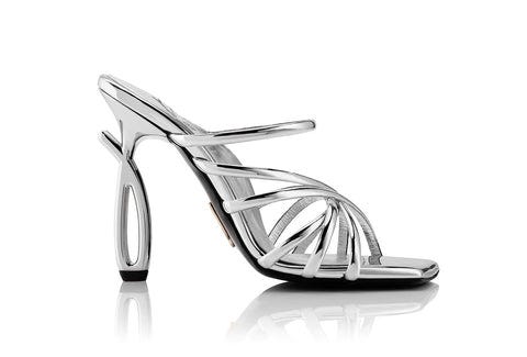 Side view of strappy silver Daniela Uribe high heels