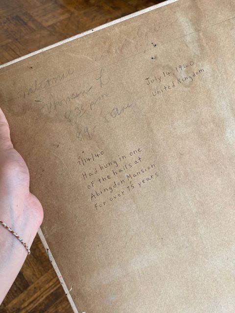 The back of a painting; on it is a handwritten note: “Had hung in one of the halls at Abingdon Mansion for over 75 years.”