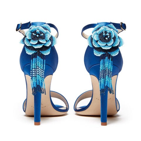 Back view of blue Mia Becar heels with flower embellishment