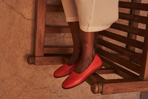 person in red Barkal flat shoes.