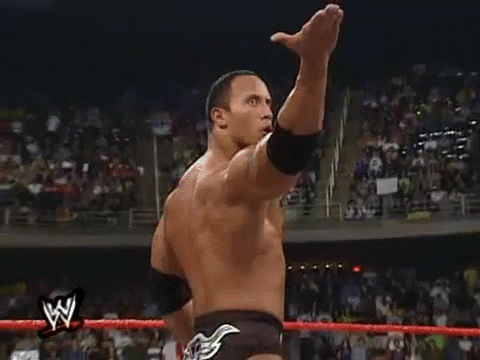 The Rock when he was a wrestler doing a hand gesture like come at me