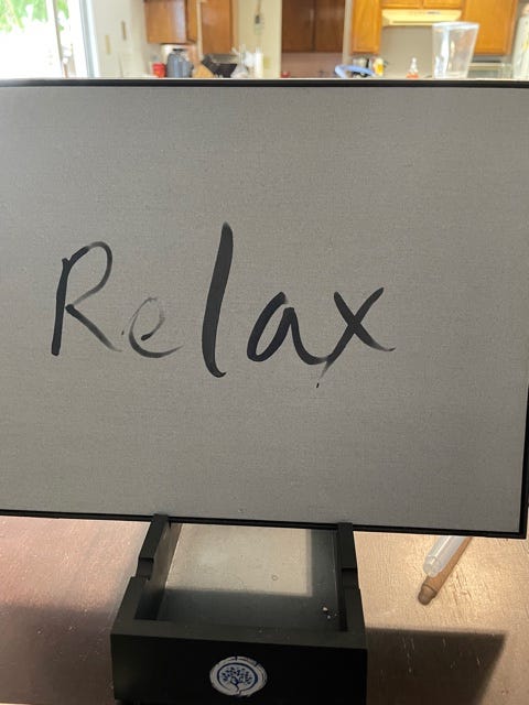 Relax written on a Sartori board.