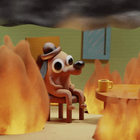 3D rendered version of the “this is fine” meme. A cute dog sits calmly at a table with a coffee cup while the room bursts into flame around it.