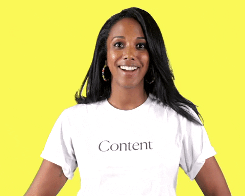 Animated GIF. Woman pointed to her shirt that says “Content”.