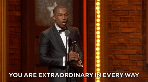 A man in a suit saying “You are extraodinary in every way”