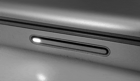 The light indicator on an early macbook.