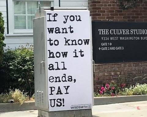 Sign next to Culver Studios saying “If you want to know how it all ends, PAY US!”
