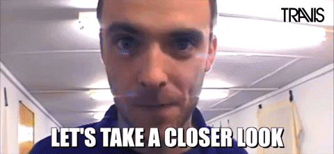 A person staring at the camera and rapidly coming very close so as to cover the entire frame with their face. Text in all caps impact font that says “Let’s take a closer look”