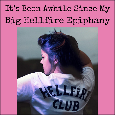 Picture of young woman viewed from the back, wearing a shirt that reads ‘Hellfire Club”