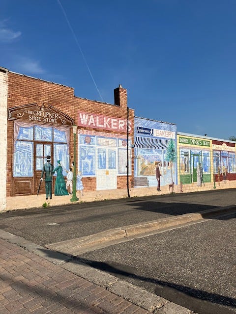 Mural of a small town on a small-town wall