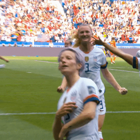 Megan Rapinoe celebrating a soccer game win.