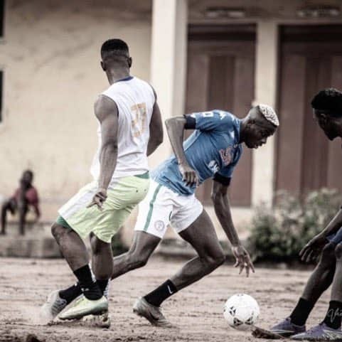 Victor Osimehn playing football locally in Lagos, Nigeria